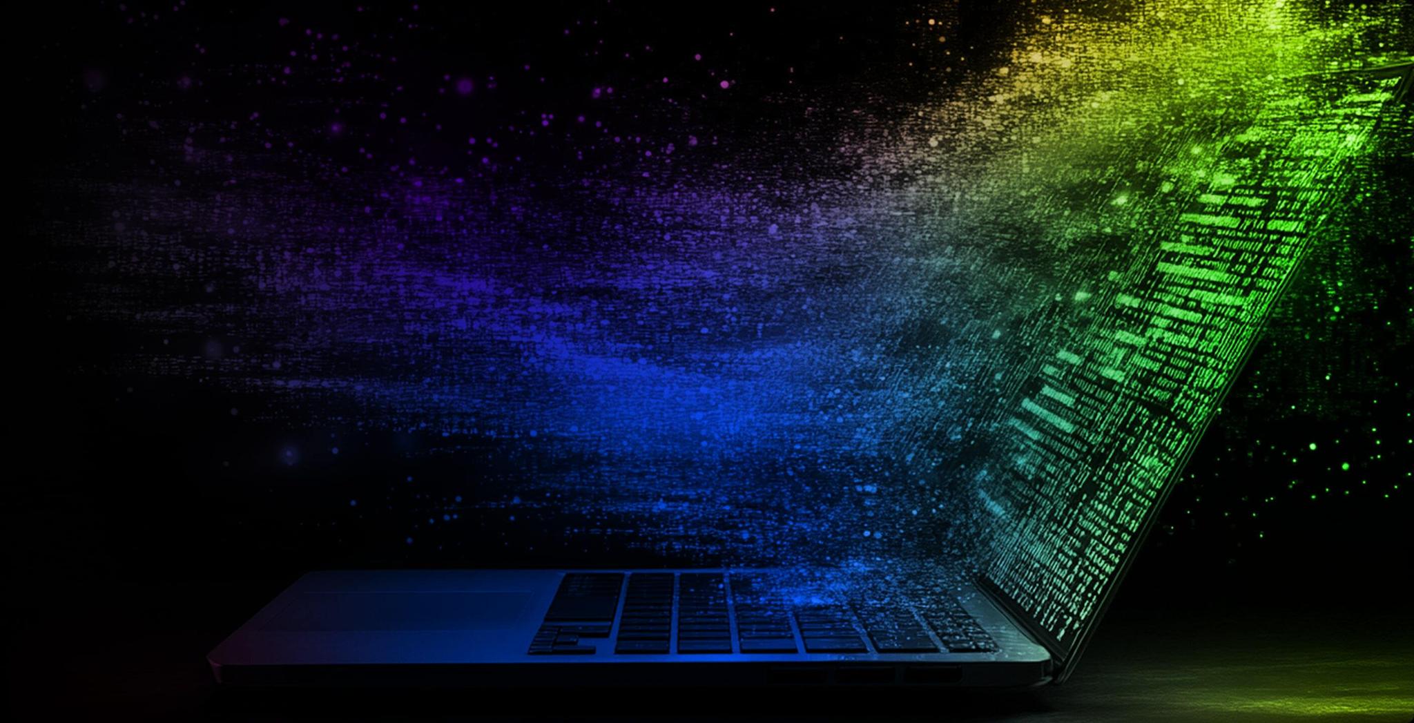 Laptop with colorful digital particles streaming from the screen