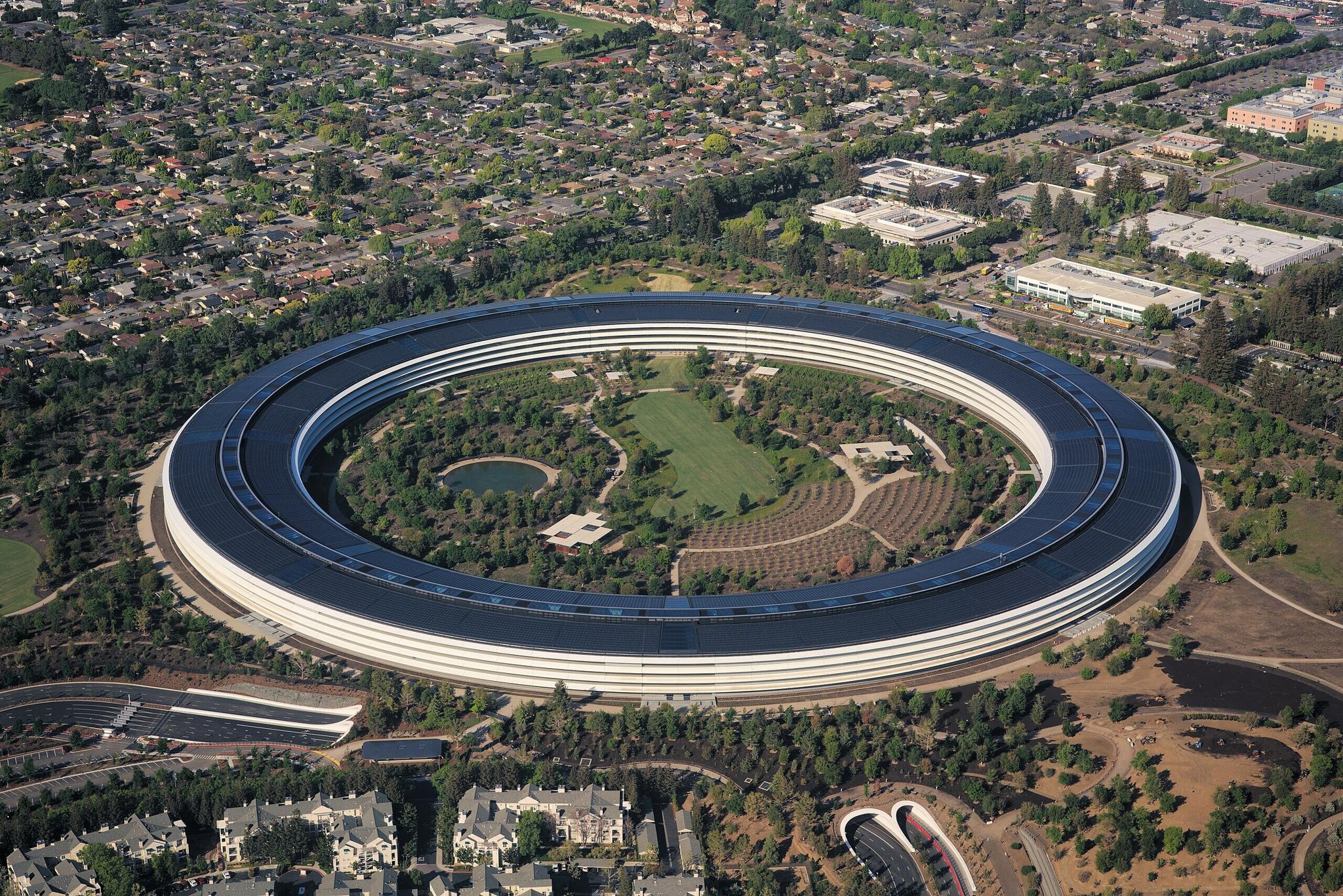 Aerial view of Apple Park circular campus surrounded by trees