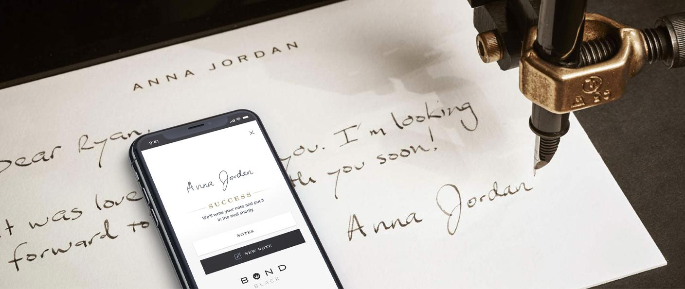Smartphone on a handwritten note beside a fountain pen nib