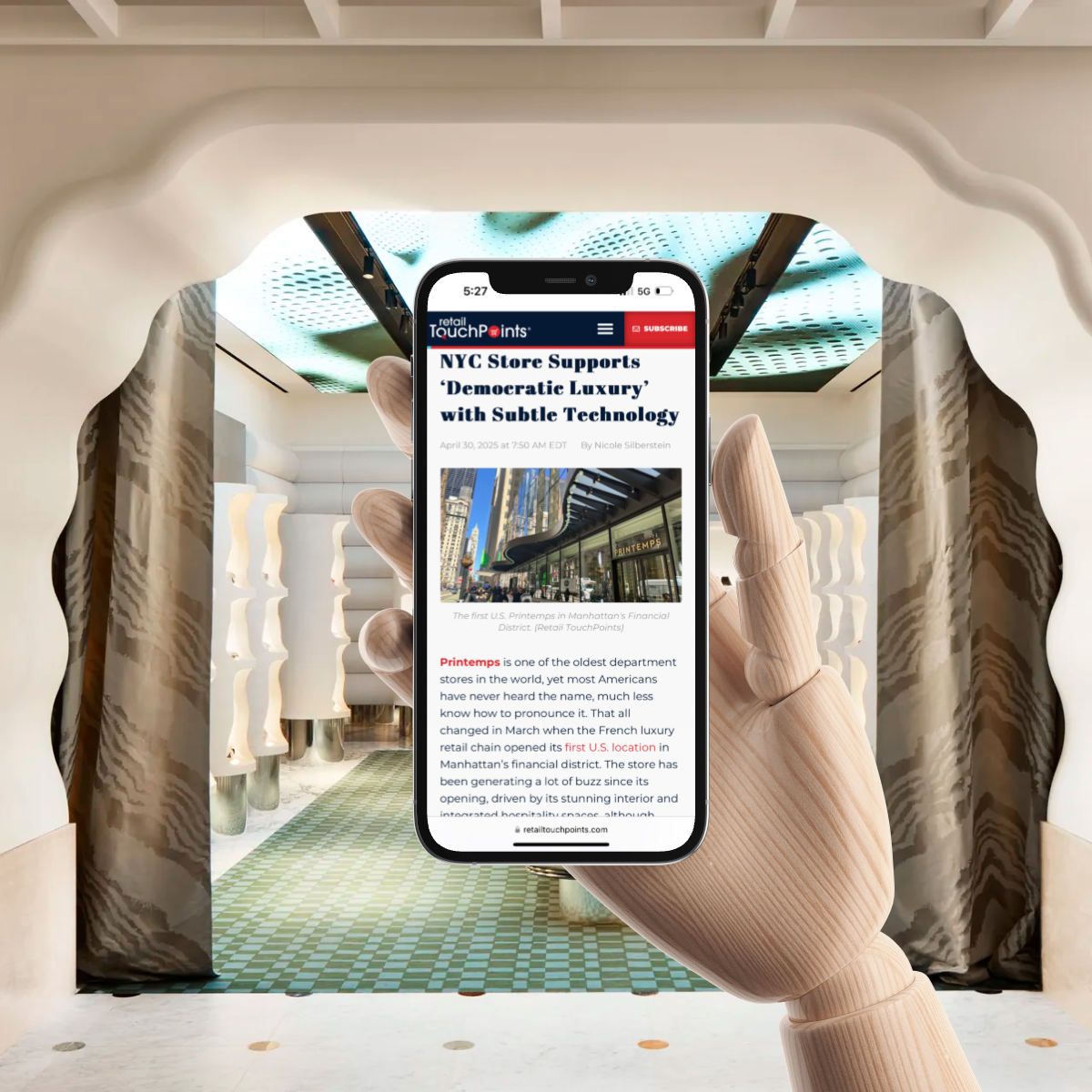 Wooden hand holding a phone with a retail TouchPoints article inside a luxury store