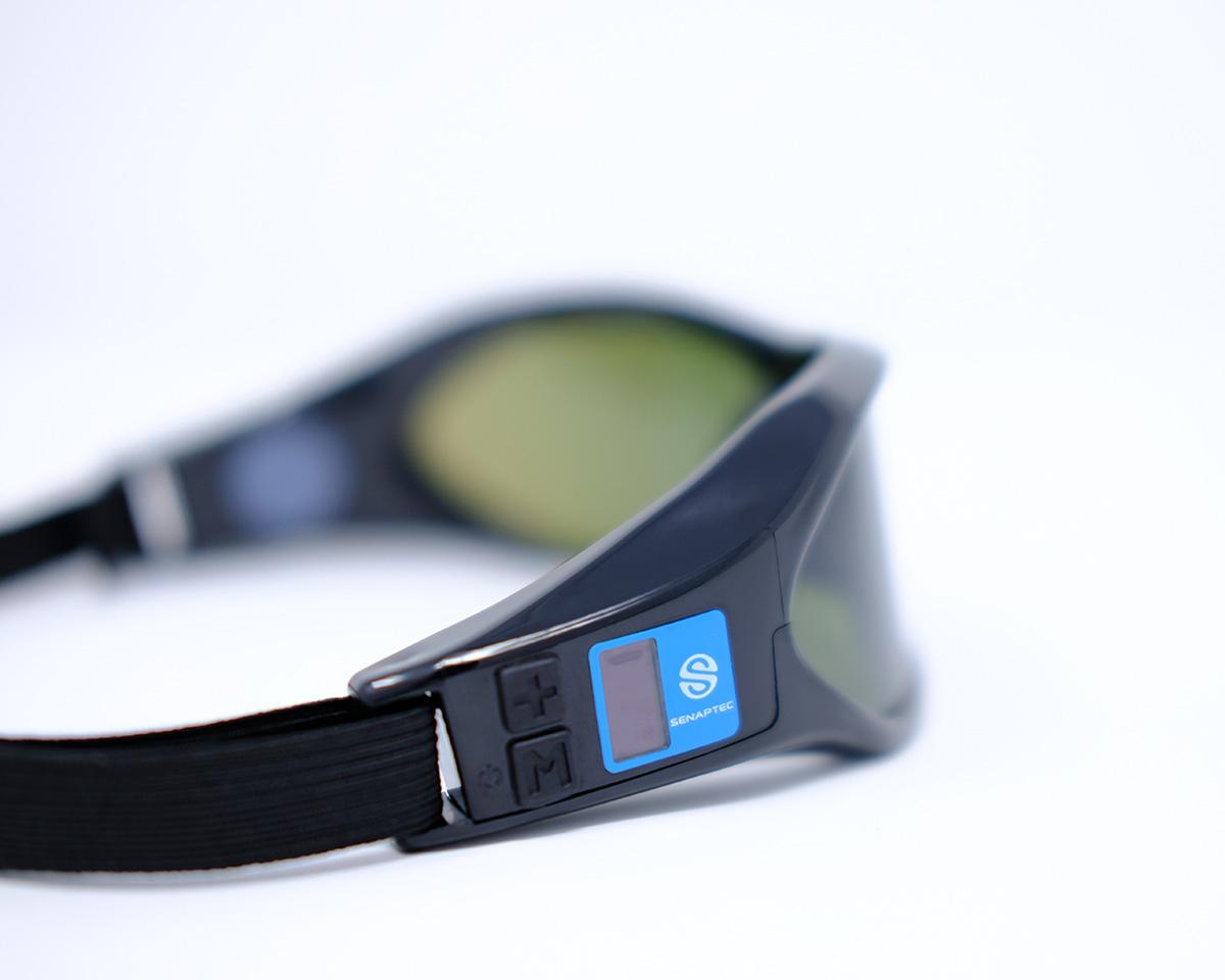 Close-up of black smart sunglasses with a blue side button