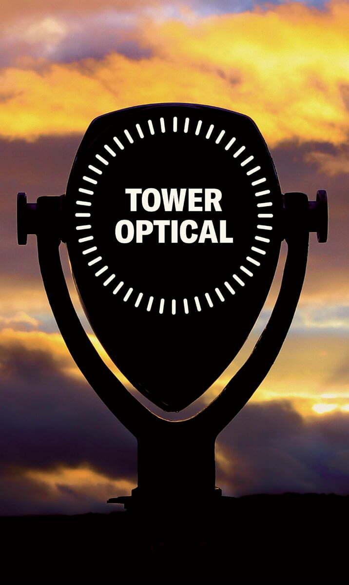 Silhouette of a Tower Optical coin-operated viewer at sunset