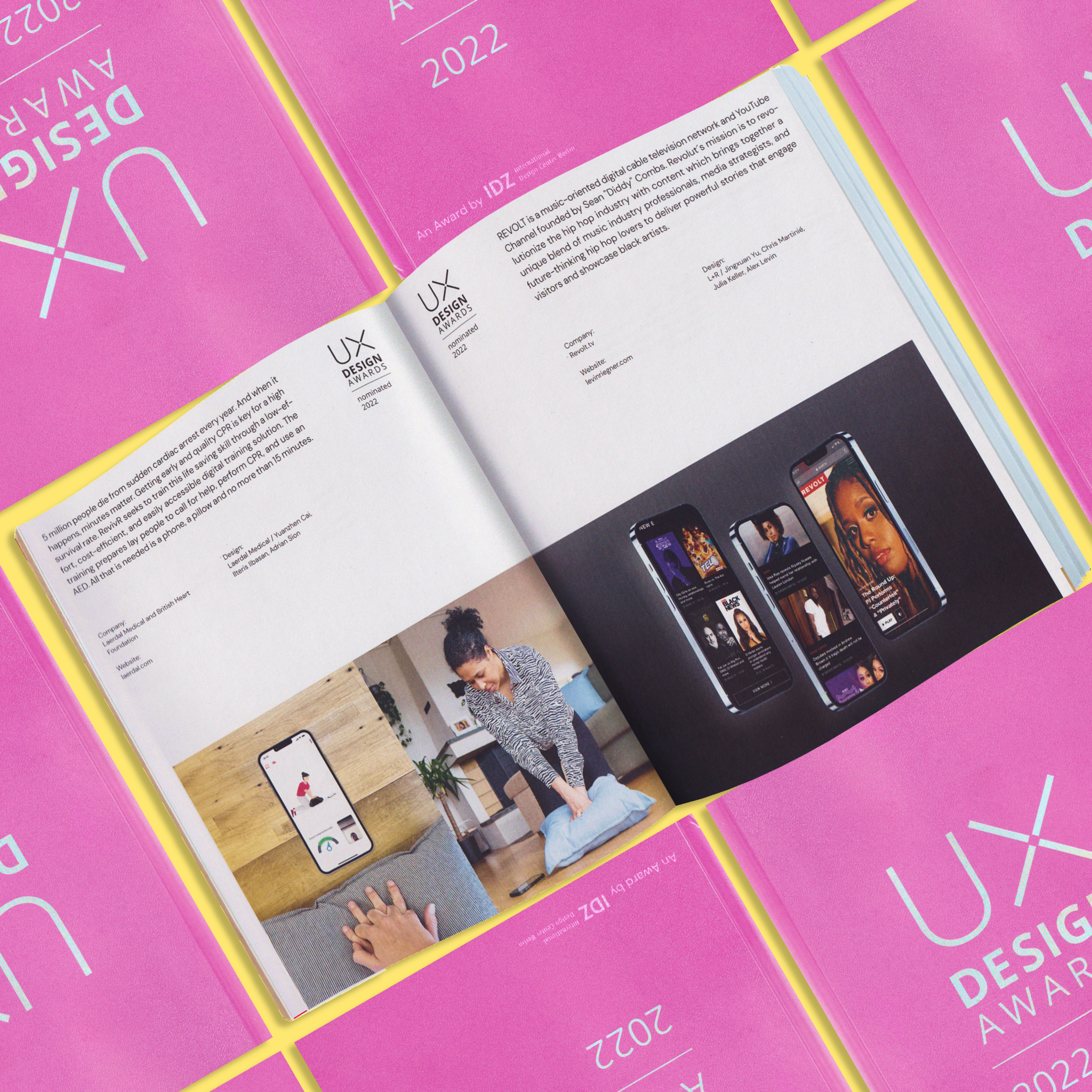 Open UX Design Awards book showing app case study pages on pink covers