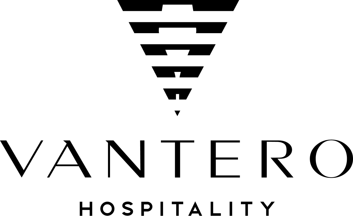 VANTERO Hospitality black logo on green background