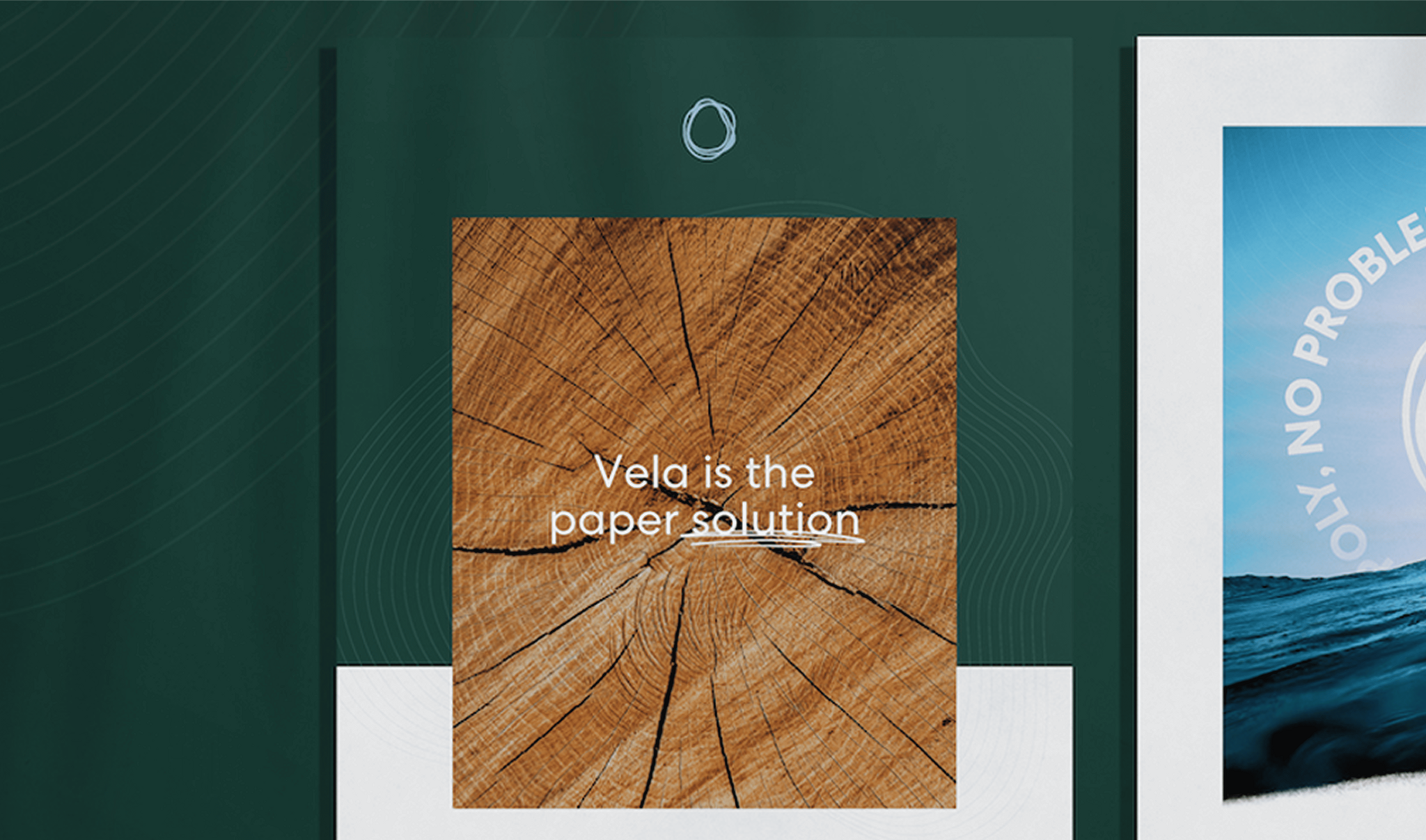Wood grain card reading "Vela is the paper solution" on a dark green background