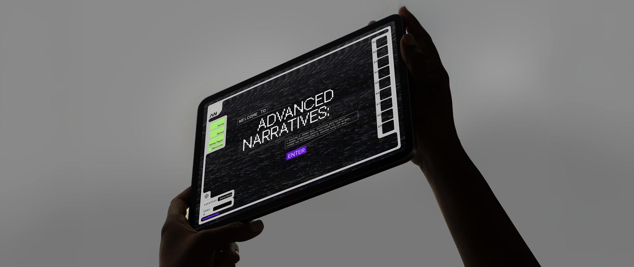 Hands hold a tablet showing an Advanced Narratives interface.