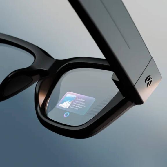 Close-up of smart glasses showing a small notification in the lens