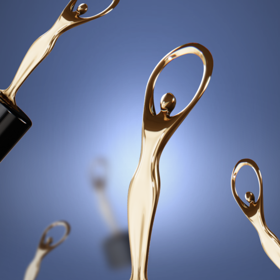 Gold statuette trophies against a blue background