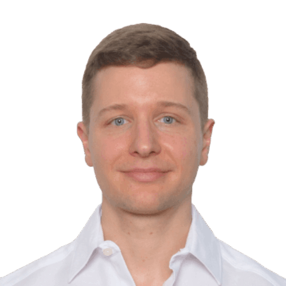 Head-and-shoulders portrait of a man in a white collared shirt on a green background
