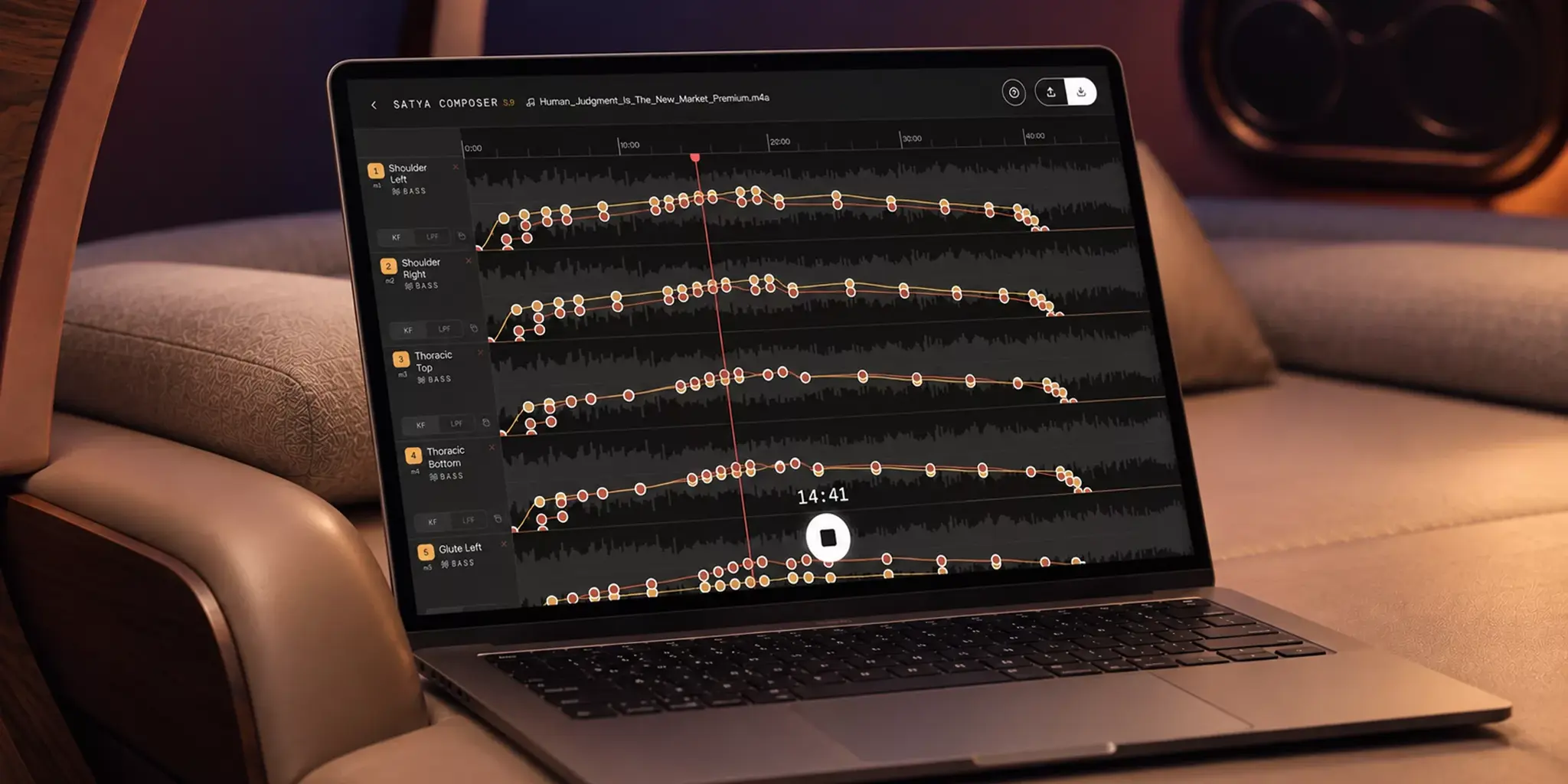 Close-up of Composer waveform tracks with colored keyframes and a play button.
