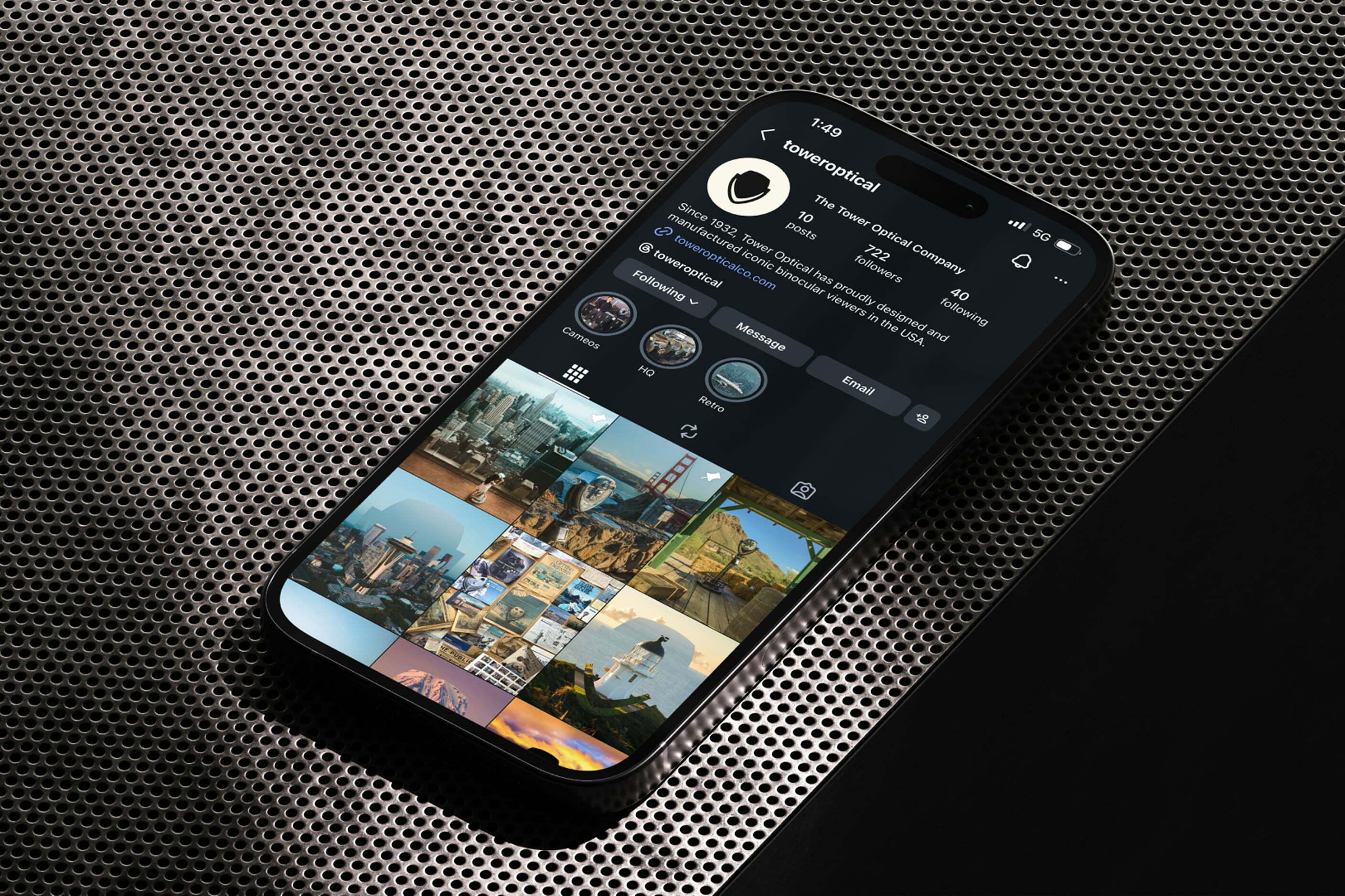 Smartphone showing a social media profile on a textured surface