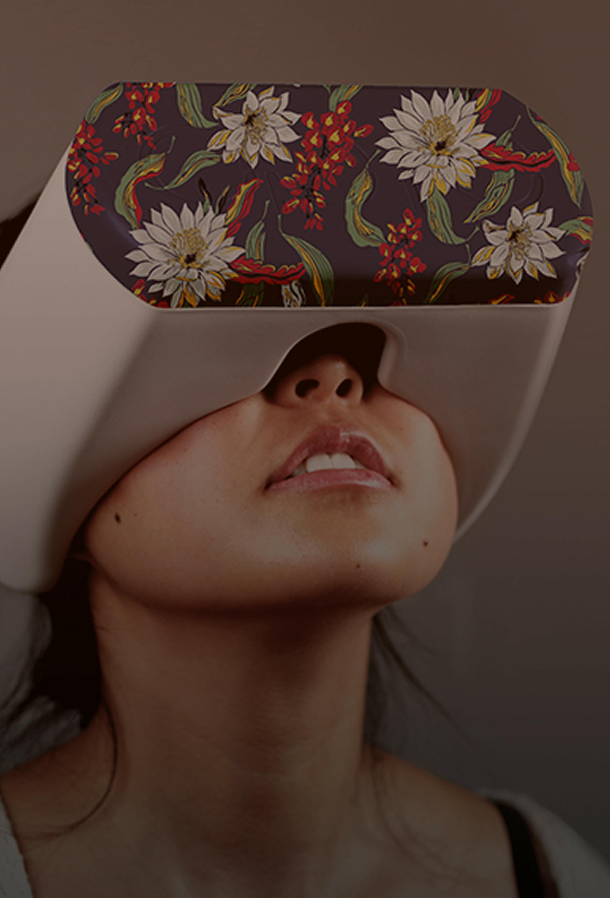Person wearing a floral-patterned virtual reality headset