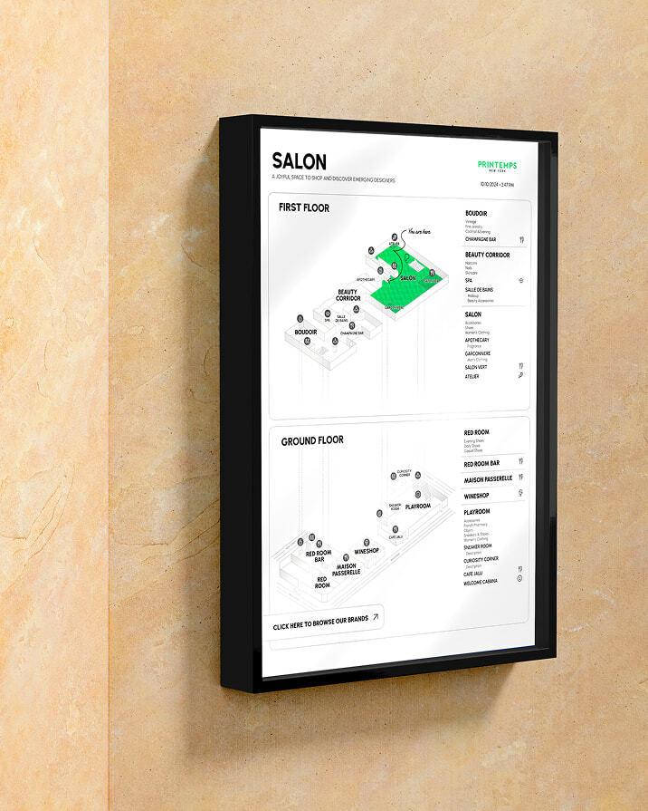 Wall-mounted SALON directory map in a black frame