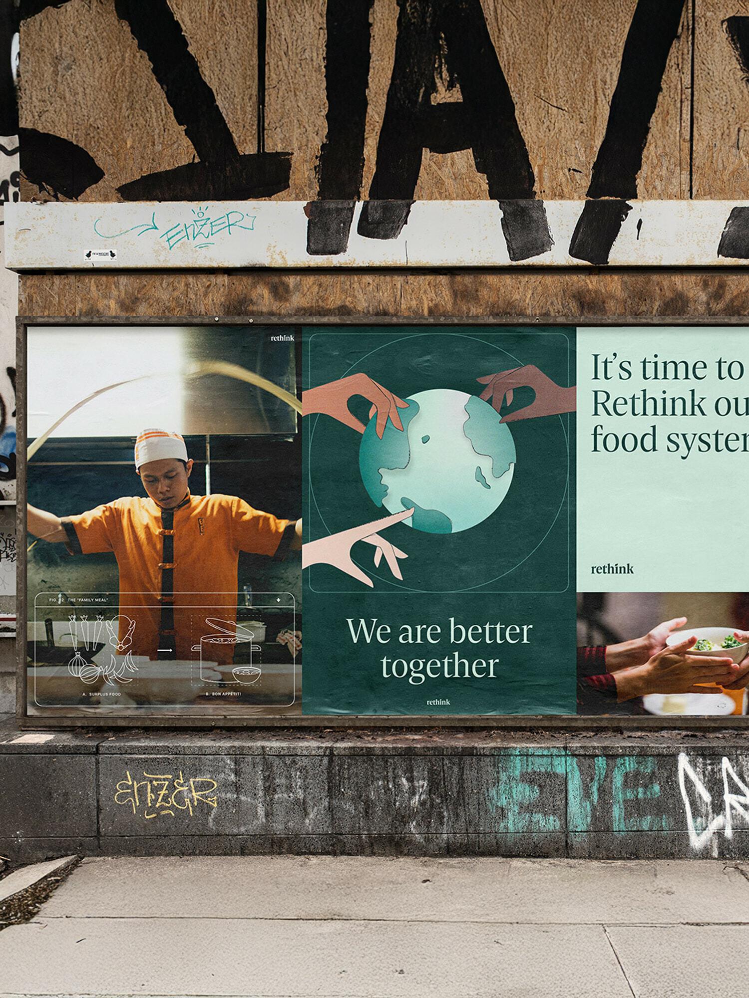 Storefront posters about rethinking food systems, teamwork, and sustainability on a graffiti-marked street