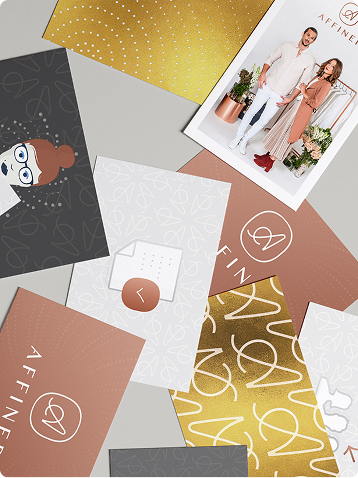 Assorted branded stationery and patterns with a fashion lookbook card on a gray background
