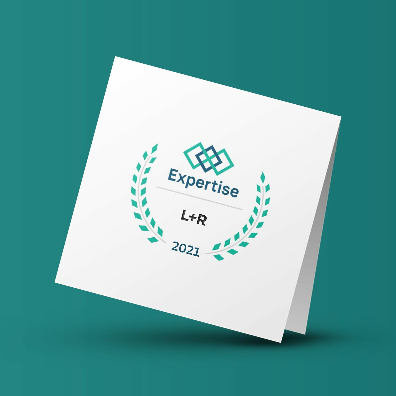 White card reading Expertise L+R 2021 with laurel graphic