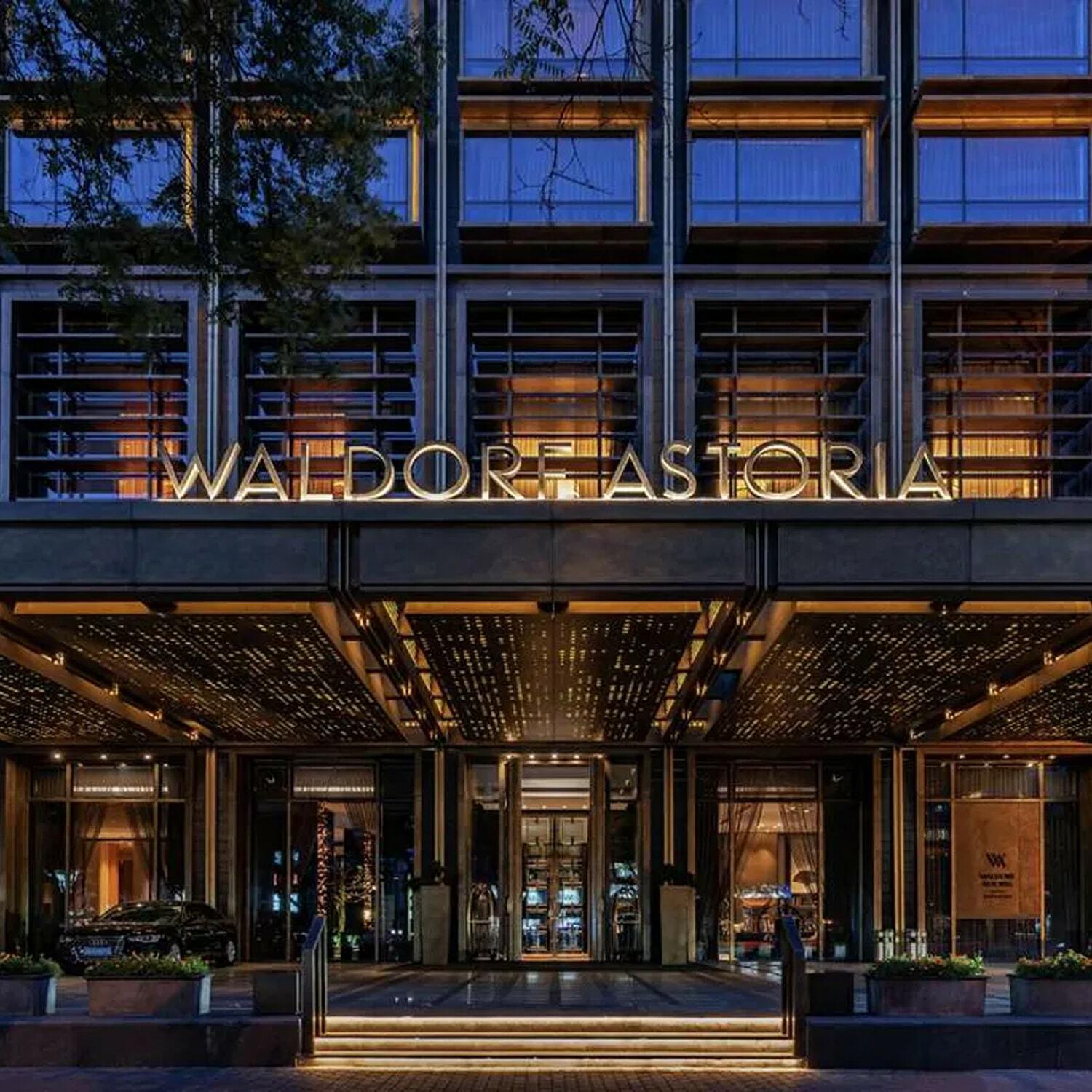 Waldorf Astoria hotel entrance illuminated at night