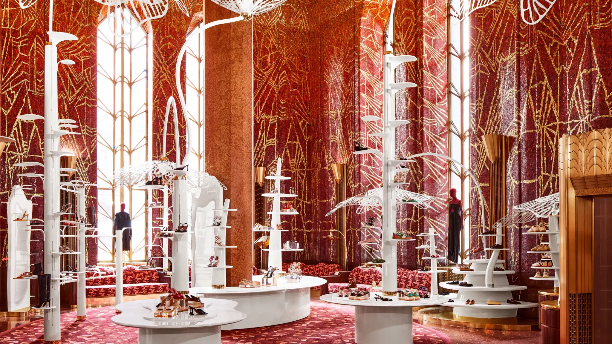 Ornate red retail interior with white displays and tall columns