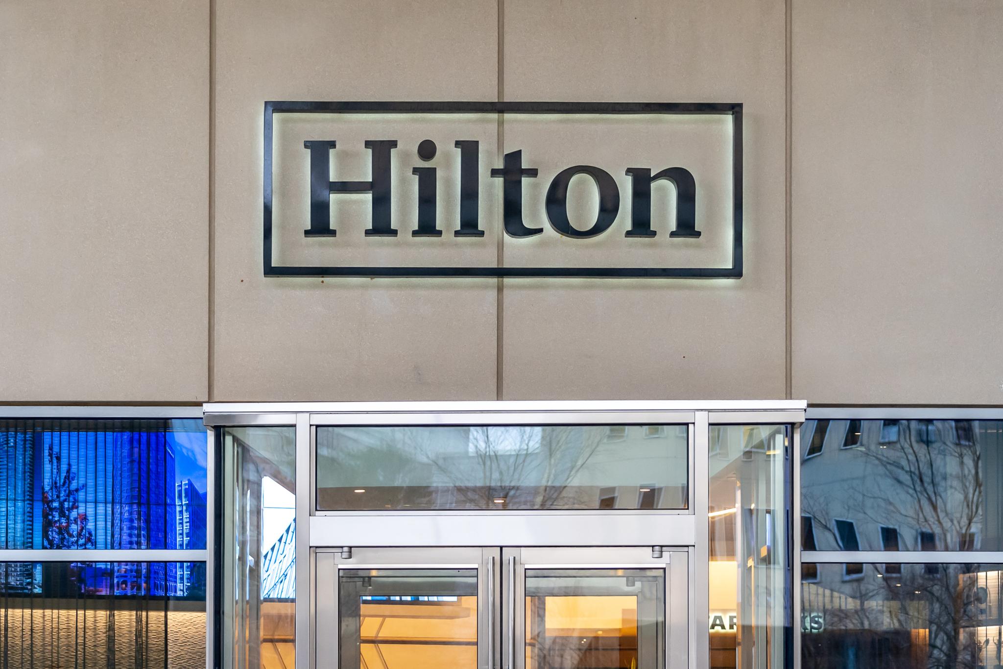 Hilton sign above glass entrance doors