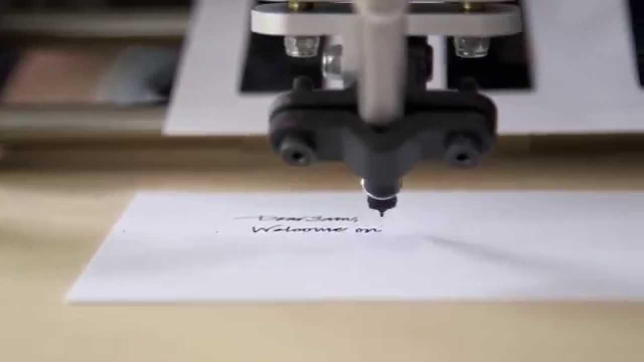Machine pen writing on a sheet of paper