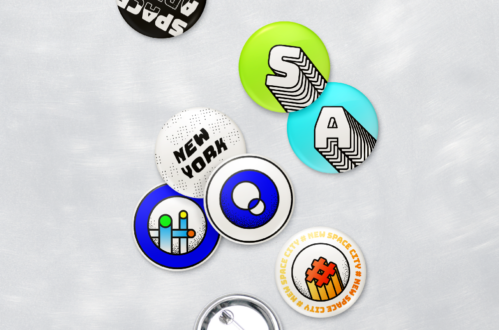Colorful illustrated buttons with New York and space-themed designs