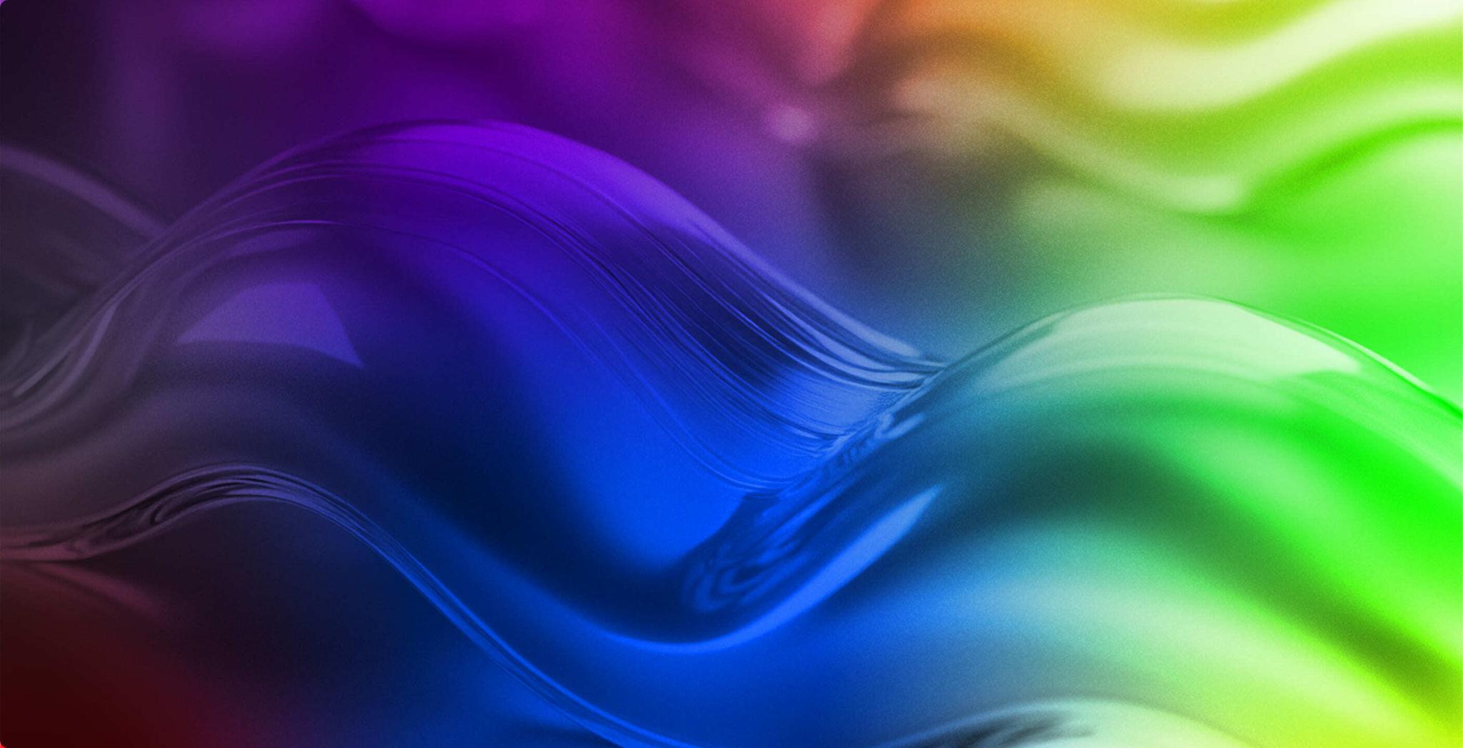 Abstract glossy waves lit in blue, purple, and green