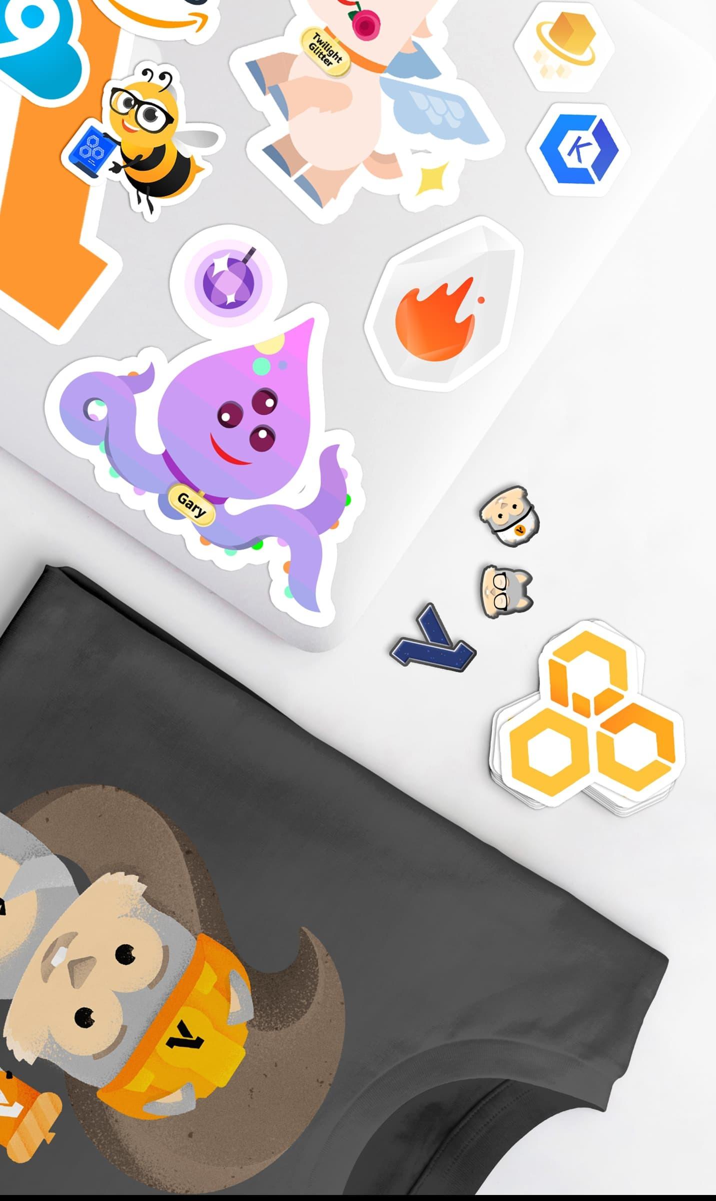 Laptop and shirt covered with colorful tech-themed stickers