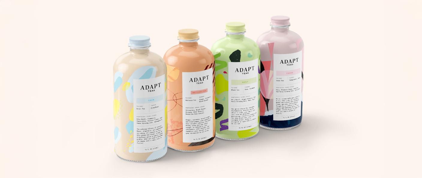 Four Adapt Tea bottles with colorful labels
