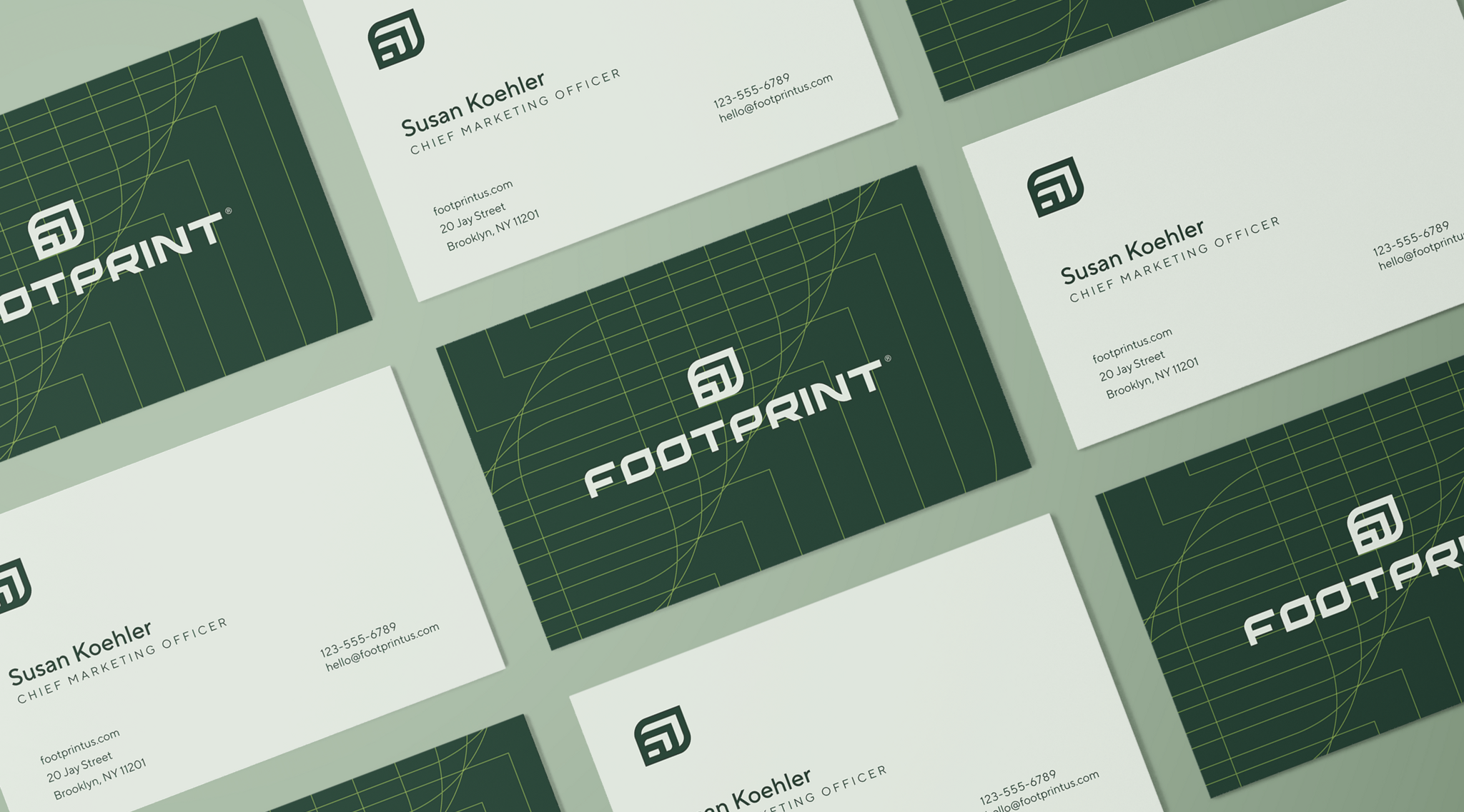 Footprint business cards arranged on a pale green background