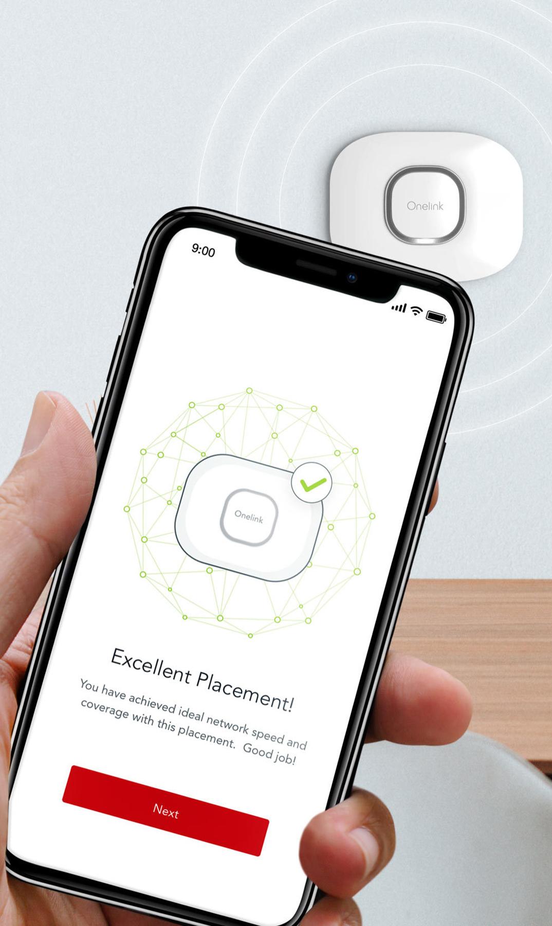 Hand holding phone showing excellent placement for a wall-mounted Onelink device