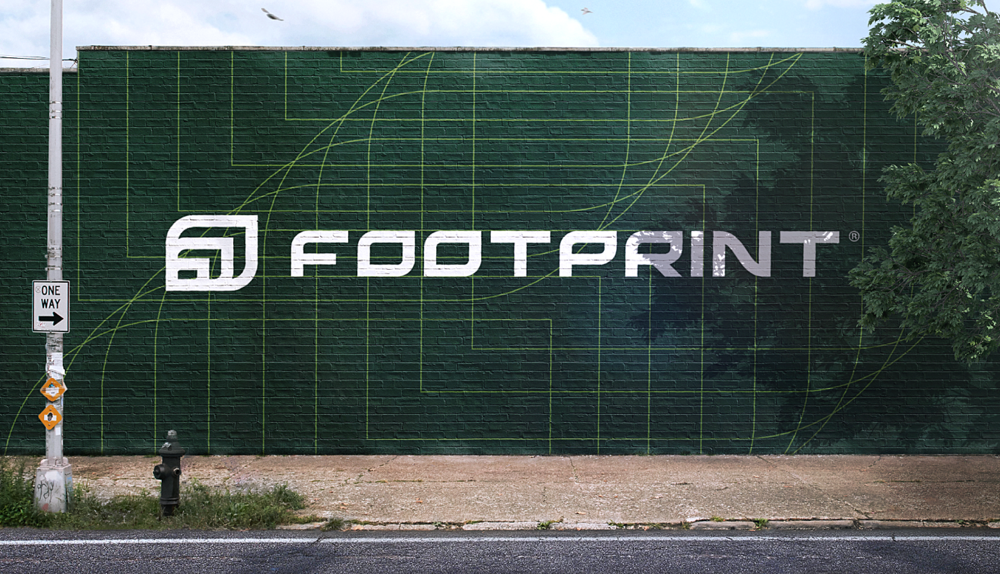 Large Footprint logo mural painted on a dark green brick wall