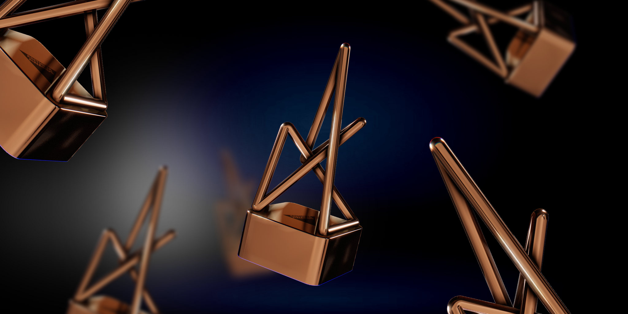 Bronze abstract trophy shapes floating on a dark background
