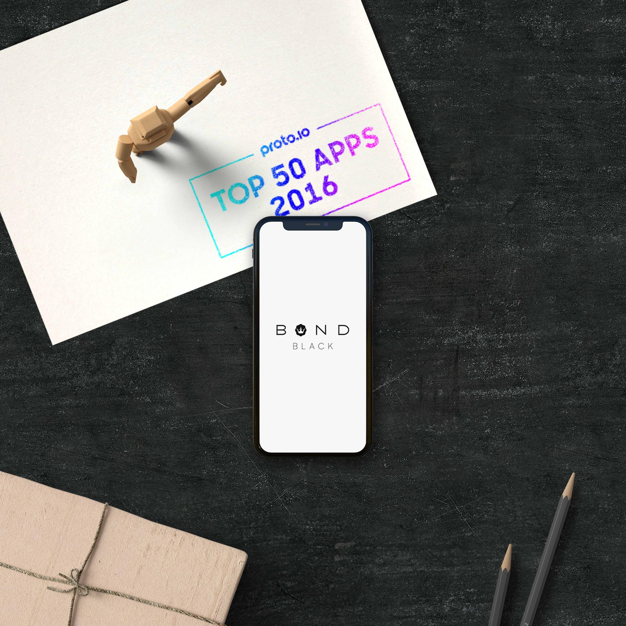 Phone showing Bond Black logo beside Protolojo Top 50 Apps 2016 stamp on paper