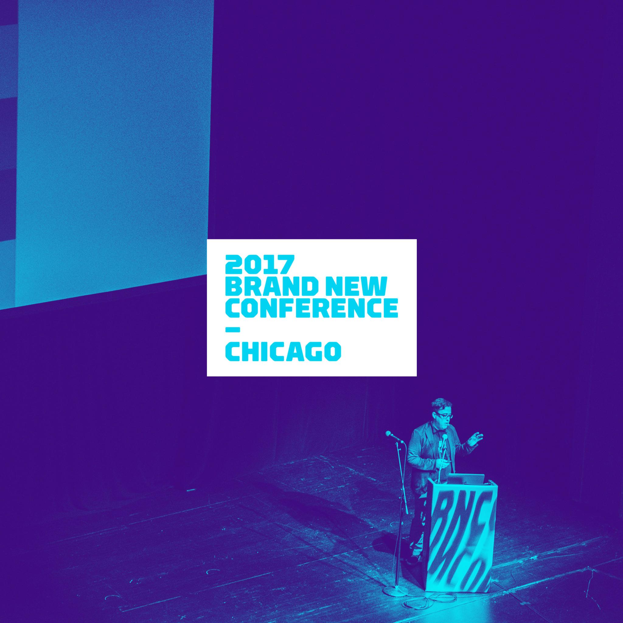 Speaker at podium on purple-lit stage with 2017 Brand New Conference Chicago screen