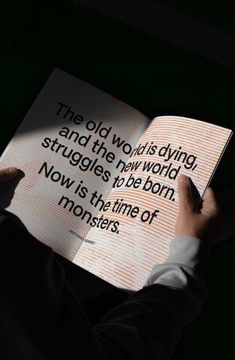 Open book showing the quote: "The old world is dying... Now is the time of monsters"