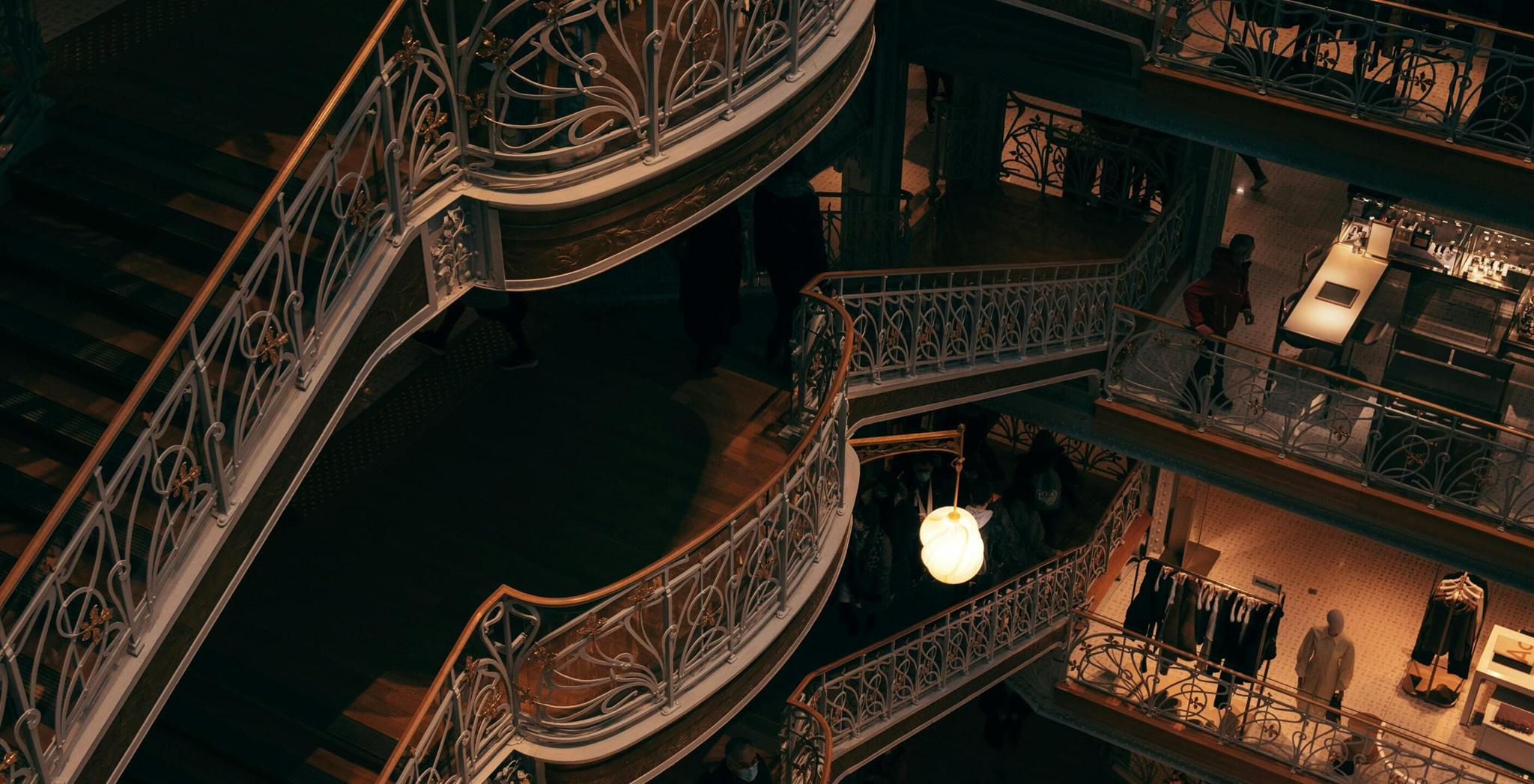 Retail 2 min Ornate multi-level staircase inside a dimly lit building