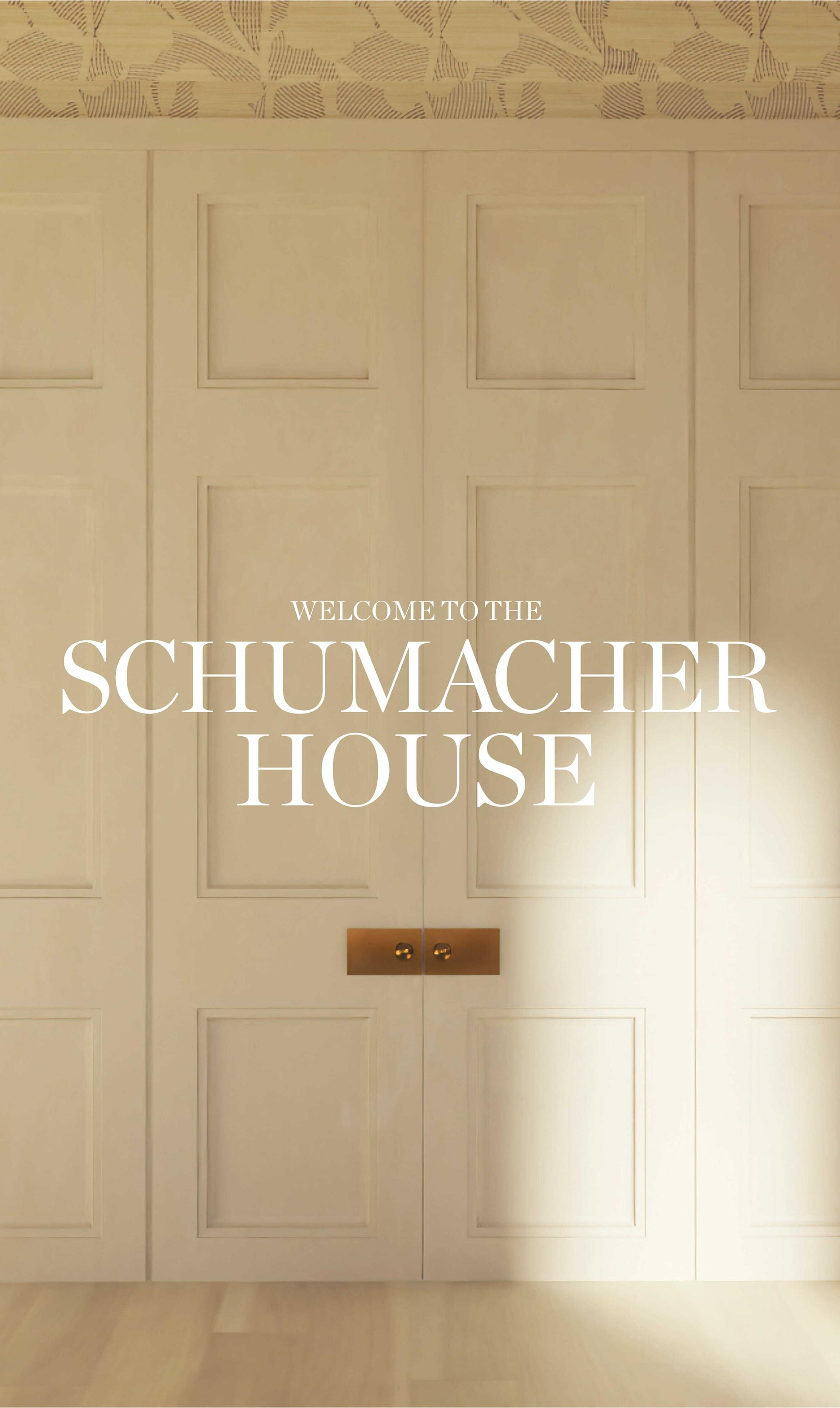 Double doors with text reading Welcome to the Schumacher House