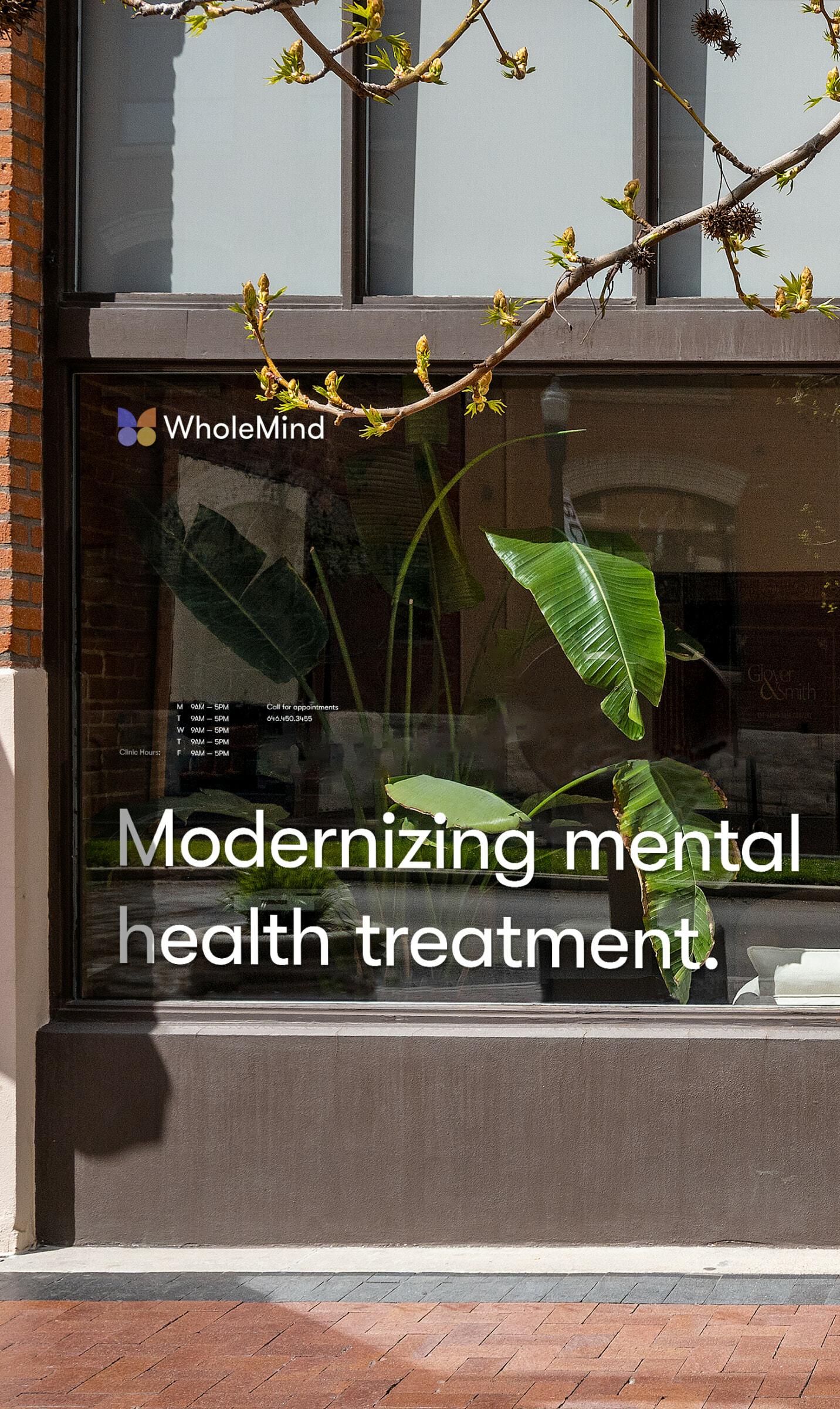 WholeMind storefront window with plants and text reading "Modernizing mental health treatment."