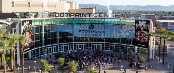 Footprint D Cover Footprint Center arena entrance with crowds outside and Valley Proud banners