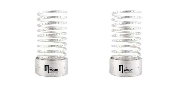 Two silver Webby Awards spiral trophies on a white background