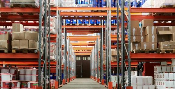 Consumer Goods 2 min Tall warehouse aisles with shelves of boxes and supplies