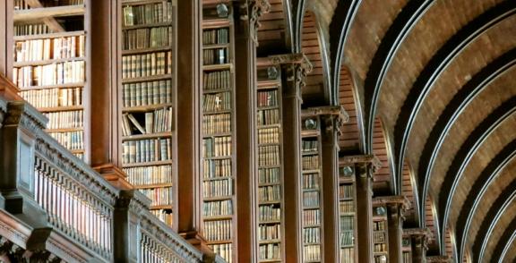 Education 2 min Tall bookshelves and arched ceilings inside a historic library