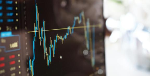 Finance 2 Close-up of a stock chart with candlestick lines on a screen