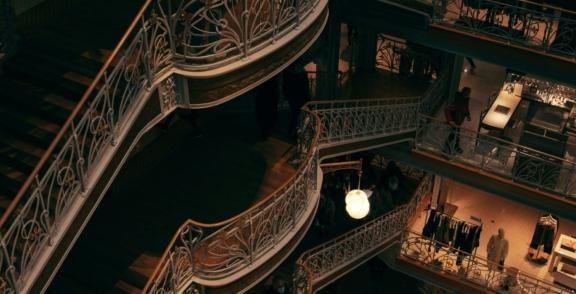 Retail 2 min Ornate multi-level staircase inside a dimly lit building
