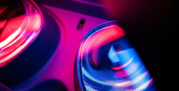 Technology 2 min Blurred red and blue spinning lights on electronic equipment