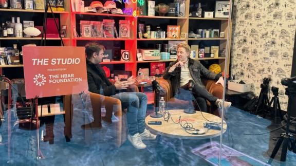 Two speakers recording a podcast in The Studio by The HBAR Foundation