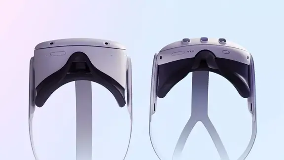 Two white mixed reality headsets on stands against a pale gradient