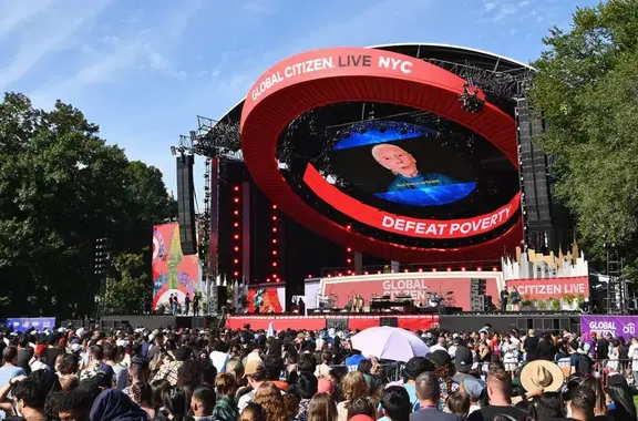 Large outdoor Global Citizen Live NYC stage facing a crowd in a park