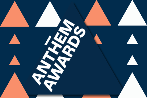Large navy triangle reading Anthem Awards over a patterned background.