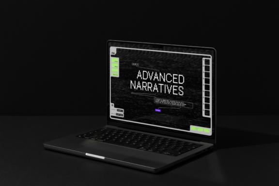 Laptop on dark surface showing Advanced Narratives interface